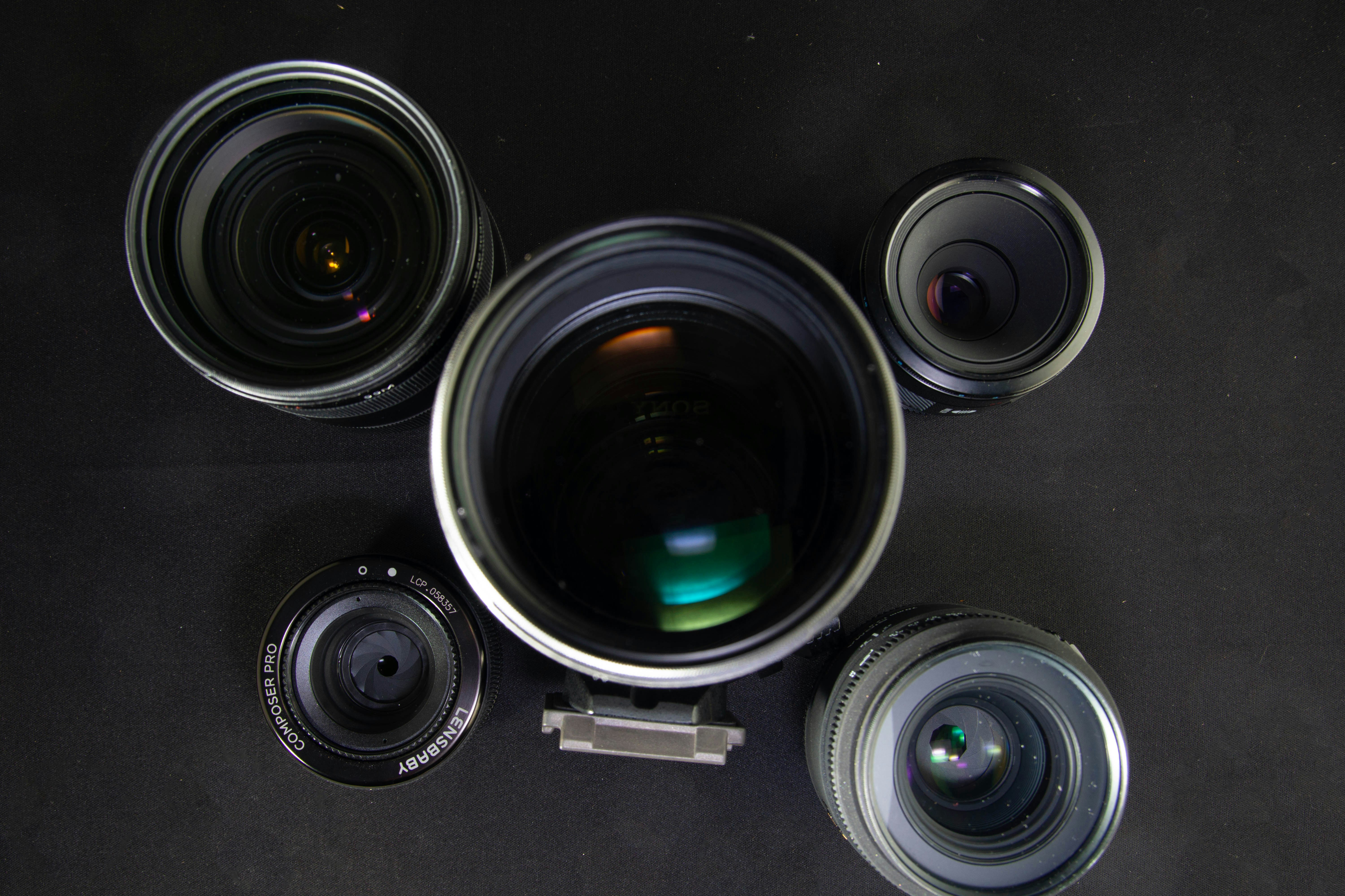 camera lenses on black surface